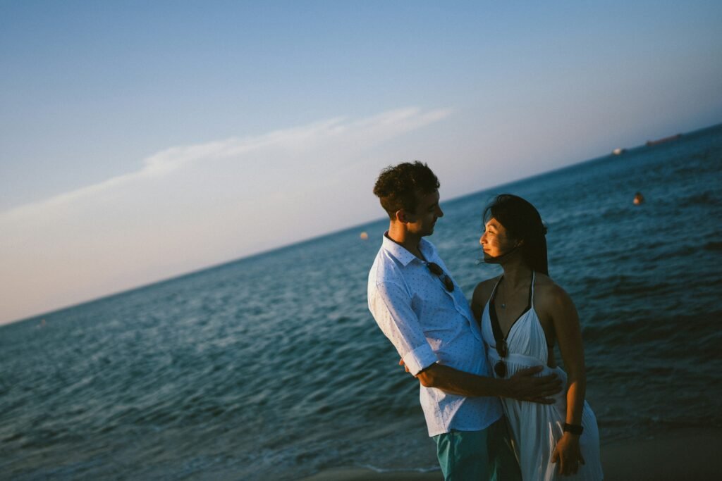 Couple embracing on a beach at sunset